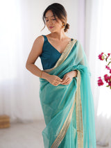 Women's Net Light Blue Embellished Designer Saree with Blouse Piece
