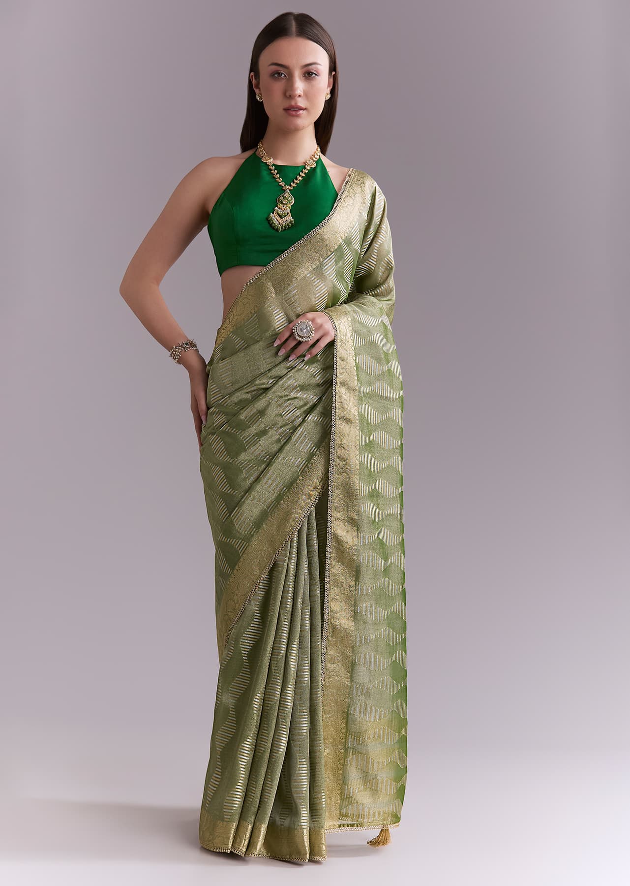 Women's Festive Light Green Tissue Saree With Subtle Weave And Zari Border