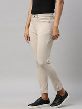 Women's Solid Beige Mid Rise Cropped Jegging