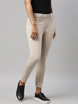 Women's Solid Beige Mid Rise Cropped Jegging