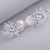 Women's Rhodium Plated CZ Floral Designer Stud Earrings with Glowing Pearls