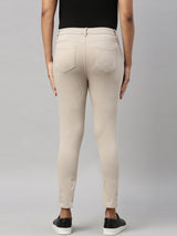 Women's Solid Beige Mid Rise Cropped Jegging